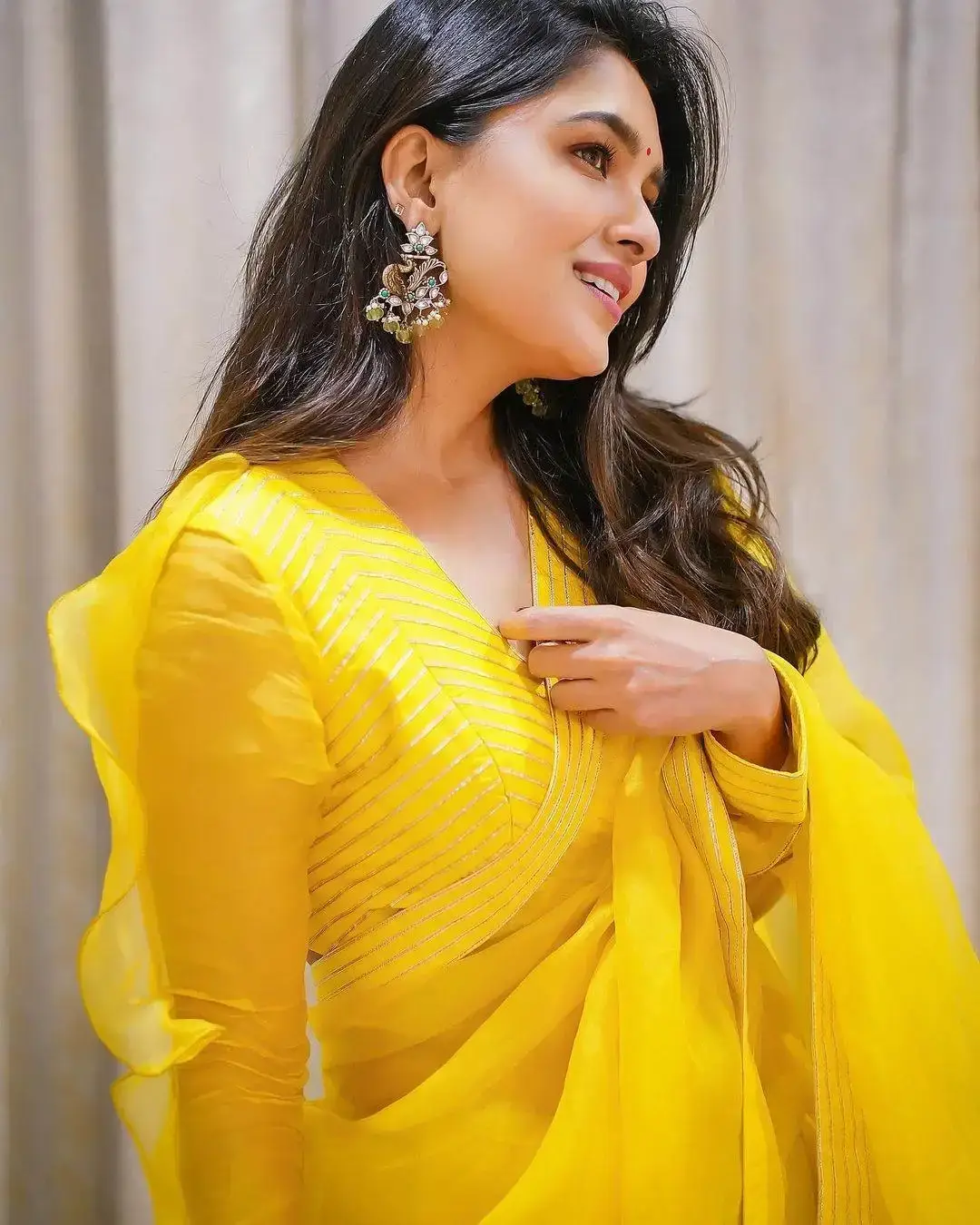 Beautiful Indian Model Vani Bhojan in yellow organza Saree